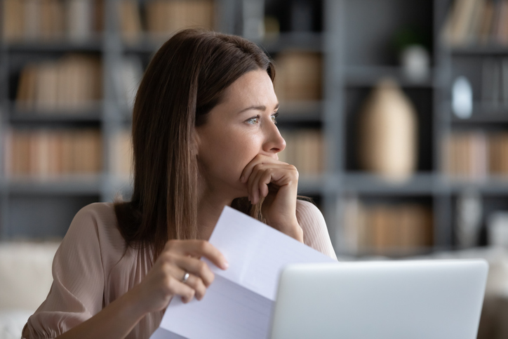 Woman looking off into distance thinking