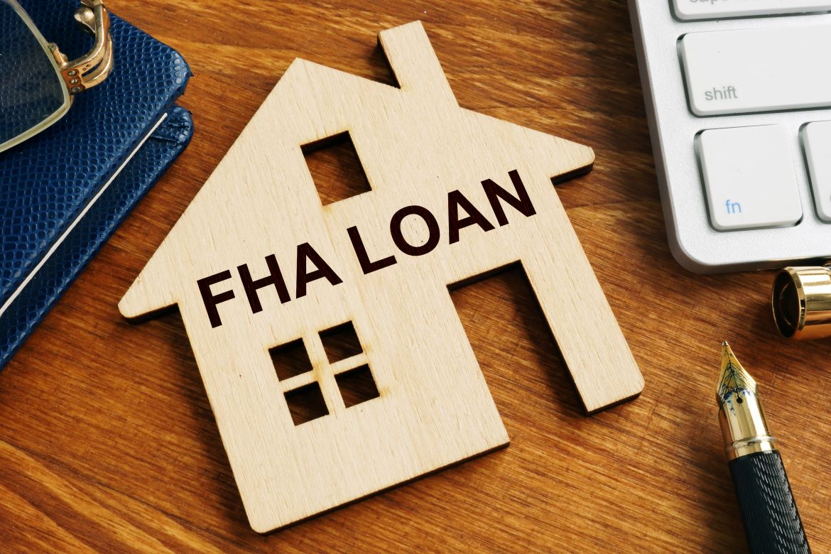 Wood house with FHA LOAN carving