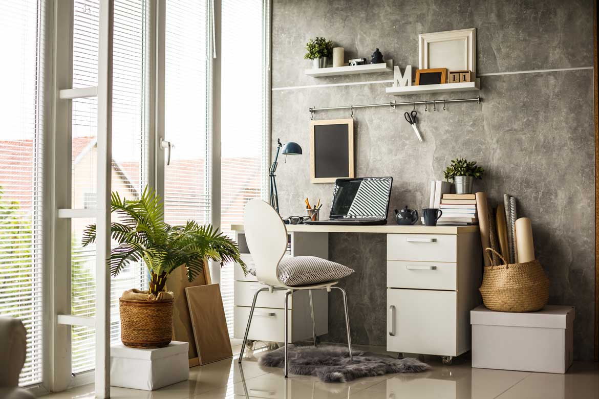 Work desk next to wall of windows